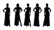 © SILHUETTECHEMBER - Five women in long dresses standing with hands on hips