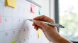 © MediaStockPro - Close up of hand marking calendar date with pen,monthly schedule planning and time management concept with reminder notes for business deadline and appointment organization