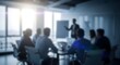 © Rina - Blurred business presentation in modern office meeting room with team listening to speaker corporate training seminar workplace background