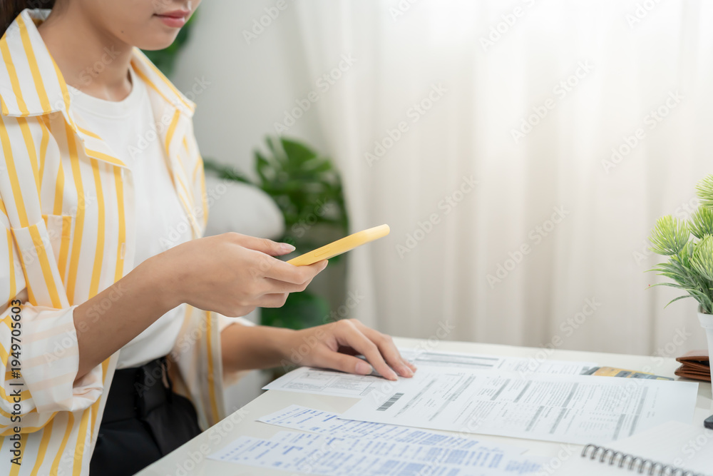 woman use phone scan barcode or QR codes to pay credit card bill after ...