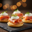 © Jim - Smoked salmon appetizers arranged on slate. Small cornbread cakes topped with cream cheese, salmon, and dill. Cozy bokeh lights add festive atmosphere for parties or events. Gourmet Party Appetizers