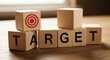 © Visual Verse - Wooden blocks spelling TARGET with bullseye symbol for business marketing goals and strategy