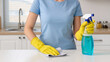 © Creative  - cleaning the kitchen, A woman cleans the kitchen, She wears protective gloves, Daily household tasks, Refreshing the kitchen space, Hygiene is the priority, Refreshing the living space