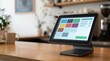 © Giggles - Point of sale terminal with dashboard tiles on cafe counter and left copy space for retail payment software presentation