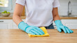© Creative  - cleaning the kitchen, She wears protective rubber gloves, Surfaces are shiny and clean, A microfiber cloth is effective, Home maintenance is very important, Housework is done with care