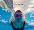 © phpetrunina14 - Underwater swimmer in pool wearing pink goggles Portrait