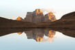 © Travel 'n' Lifestyle - View of golden light kissing the rugged peaks mirrored in the tranquil lake, creating a serene, symmetrical tableau of nature's artistry, San Vito di Cadore, Veneto, Italy.