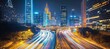 © Ilja - Vibrant Nightscape of Urban Life Glowing Highway Traffic and High-Rise Architecture in the City