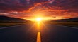 © sablengjago - Open road leading towards a vibrant sunrise, framed by distant mountains and a dramatic sky