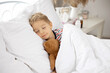 © Tomsickova - Sweet blond preschool child with teddy bear, lying in bed sick,