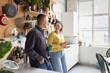 © ReeldealHD images - Young couple chatting over coffee in a kitchen