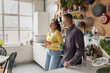 © ReeldealHD images - Roomies socialising over coffee in their kitchen