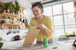 © ReeldealHD images - Young adult upcycling a vintage piece of furniture