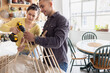 © ReeldealHD images - Young Couple Building a DIY Project Together in Kitchen