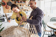 © ReeldealHD images - Friends repairing a piece of furniture together