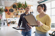 © ReeldealHD images - Couple deciding where to hang pictures in their new home
