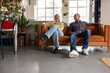 © ReeldealHD images - Smiling Couple Relaxing on Couch with Plants