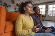© ReeldealHD images - Gaming Together on Couch, Laughing and Smiling