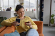 © ReeldealHD images - Young Woman Relaxing at Home shopping online