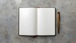 © Bilal - A blank notebook and gold pen on a gray concrete surface