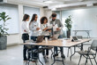 © standret - Papers, documents, reading, sharing data. Group of people are working in the office together as a team