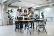 © standret - Papers, documents, reading, sharing data. Group of people are working in the office together as a team