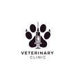 © Logo - Minimalist veterinary clinic logo with black animal paw and medical syringe symbol design