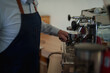 © Tj - Barista preparing fresh coffee on espresso machine
