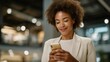 © forenna - Woman photographing improved credit score notification on phone screen while standing in bank lobby, relief expression, loan approval documents visible, professional attire under bright