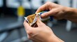© areeba - A person eating a healthy snack bar in a modern gym