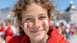 ©  VladaToday - Portrait of smiling child with canadian flag face paint on cheeks for canada day celebration and patriotic event background image