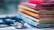 © touseef - Stack of medical journals and research papers on a desk with organized scientific literature and healthcare publications for professional study and medical research