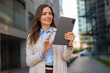 © Dexon Dee - Professional woman using tablet for mobile business outdoors
