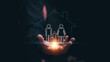 © krungchingpixs - Family protection and home security concept. Parents and child icon inside house outline above hand. Family safety, home insurance, life protection, social security and secure living environment.