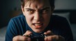 © Gianpiero - Young Caucasian man, expression of furious anger and aggressiveness while playing video games with controller