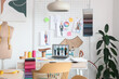 © Pixel-Shot - Interior of light fashion designer's studio with workplace and pin board