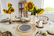 © Pixel-Shot - Vases with beautiful sunflowers on served table