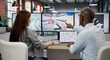 © Andrey Popov - Man And Woman Discuss BIM 3D Model Design On Computer Screen