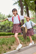 © Blue Jean Images - Two happy girls after school