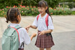 © Blue Jean Images - Two happy girls after school