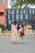 © Blue Jean Images - Mum taking her daughter to school