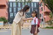 © Blue Jean Images - Mum taking her daughter to school