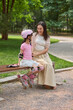 © Blue Jean Images - Mum and her daughter go roller skating in the park