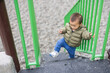 © leungchopan - Happy baby playing outdoor at colorful kid park playground