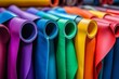 © Tetiana Kasatkina - selective focus high-volume production of colorful yoga mats