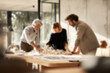 © Microstocke - Blurred Diverse Team Collaborating on Architectural Model in Bright Modern Office