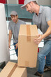 © auremar - deliverymen with happy faces carry cardboard boxes