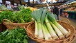 © olga_demina - A vibrant display of fresh vegetables and herbs at a bustling market, showcasing a variety of healthy and nutritious produce for cooking and culinary use.