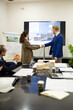 © luisrojasstock - Architects shaking hands after successful design presentation