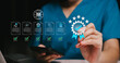 © JK_kyoto - Quality control concept. Business professional hand checking digital checklist with smartphone and laptop, quality assurance compliance audit workflow management, risk control